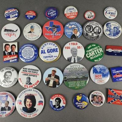 Lot 93 | 30 Vintage & Contemporary Political Pins. Some names include Trump, Obama, Clinton, Gore, Dukakis and more.
