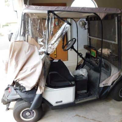 1995 EZGO gold cart with soft sides. Still runs great, well maintained and reconditioned. 2 seater. 