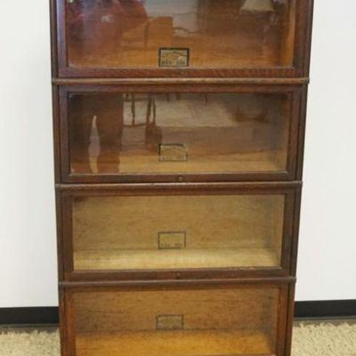 1125	OAK GLOBE WERNICKE 4 SECTION BARRISTER BOOKCASE, ONE DRAWER AT BASE, APPROXIMATELY 34 IN X 12 IN X 68 IN HIGH

