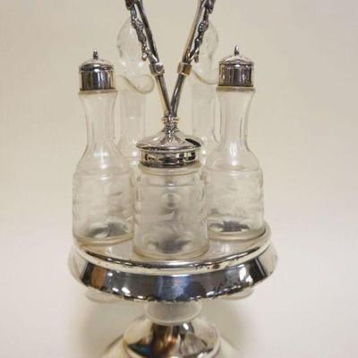 1079	VICTORIAN CASTOR SET W/5 CLEAR BOTTLES IN SILVERPLATE HOLDER, APPROXIMATELY 14 1/2 IN HIGH

