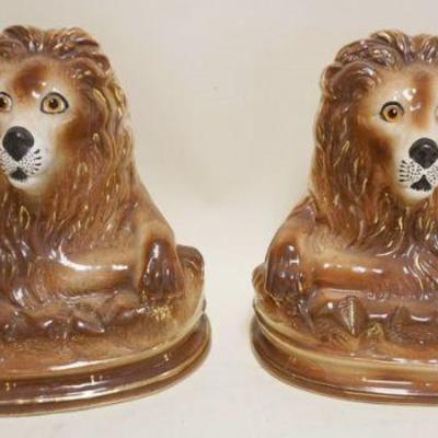1186	PAIR OF STAFORDSHIRE LIONS WITH GLASS EYES, APPROXIMATELY 12 IN X 9 IN 7 IN H
