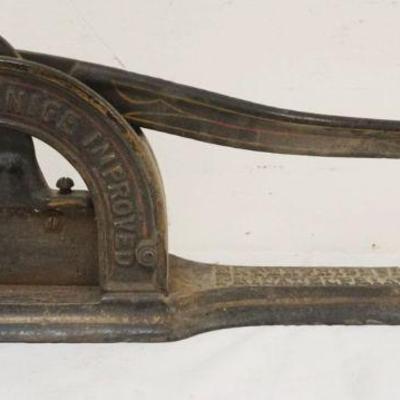 1042	ANTIQUE CAST IRON TOBACCO CUTTER *ENTERPRISE CHAMPIAN KNIFE* APPROXIMATELY 19 IN X 7 IN HIGH
