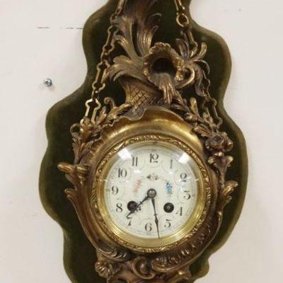 1052	HANGING WALL CLOCK IN ORNATE CAST METAL CASE W/BELL STRIKE, APPROXIMATELY 7 IN X 10 IN X 26 IN HIGH
