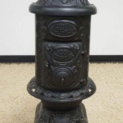 1143	CAST IRON POT BELLY STOVE *THE KEELEY STOVE* COLUMBIA PA 13 JUN OAK, APPROXIMATELY 46 IN HIGH
