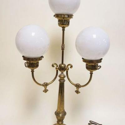1164	BRASS 3 LIGHT TABLE LAMP IN THE STYLE OF A GAS FIXTURE WITH 3 MILK GLASS BALL SHADES, APPROXIMATELY 32 IN H
