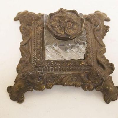 1082	VICTORIAN INKWELL IN ORNATE CAST BRASS HOLDER, APPROXIMATELY 6 IN SQ X 3 IN HIGH
