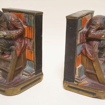 1003	ARMOR BRONZE GS ALLEN BOOKENDS, MAN CROUCHED OVER READING IN LIBRARY, APPROXIMATELY 8 1/2 IN HIGH
