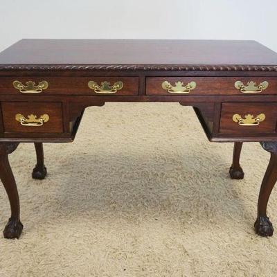 1130	MAHOGANY DESK WITH 4 DRAWERS ON CABRIOLE BALL AND CLAW FOOT LEGS AND REEDED QUARTER COLUMN SIDES, APPROXIMATELY 47 IN X 22 IN X 31...