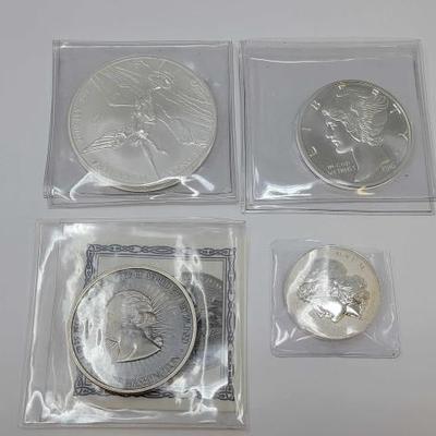 #562 â€¢ (4) Silver Coins
