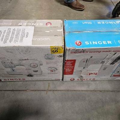 #6218 â€¢ 2 New Singer Sewing Machines

