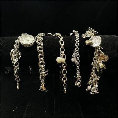 Lot 043   1 Bid(s)
Silver Tone Charm Bracelets Group of 5