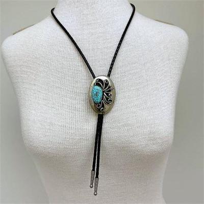 Lot 002-101   1 Bid(s)
J. Tedder Signed Silver and Leather Turquoise Bolo Tie