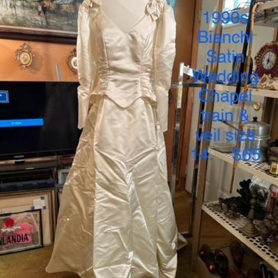 Beautiful Vintage Wedding gown 1990s Bianchi Satin $50
  Attached Chapel Train   Size 14
Gourgeous Satin covered buttons on back of...