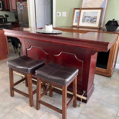 Cherry wood home bar.  Stools did not come with the set but can be included in the purchase.  