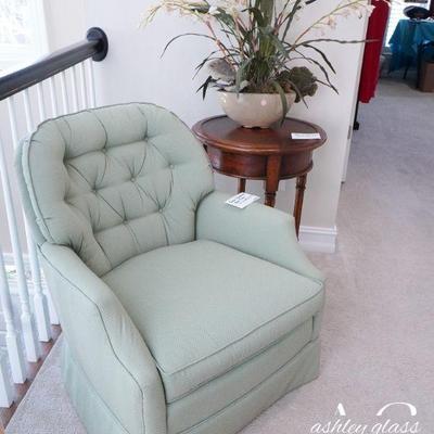Green upholstered arm chair (31â€h x 28â€ w x 31â€ d)
