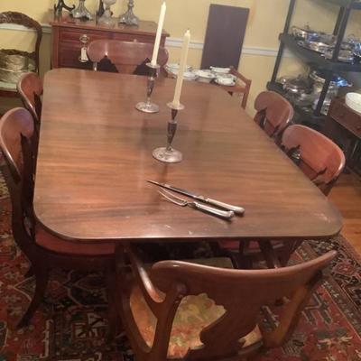 SOLD Dining table with 3 leaves & 8 chairs - 2 of which are captains chairs 