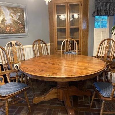 Round dining table with 6 chairs and cover