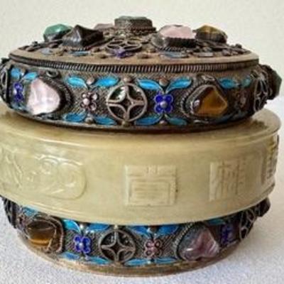 Antique Chinese Precious Stone Inlaid Cylinder Box with Jade Bracelet 

Beautiful cylindrical box covered with silver filagree and inlaid...
