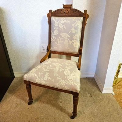 Elegant Antique Eastlake Style Carved Chair with Floral Upholstery White on Gray - Turned Front Legs on Casters