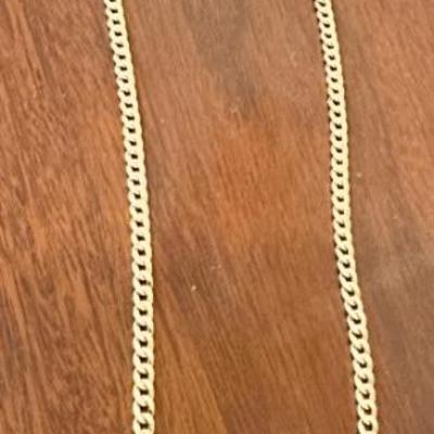 Long curb link gold chain marked 750