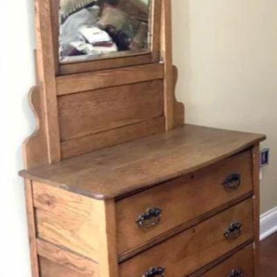 Antique dresser with beveled mirror