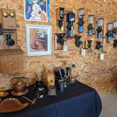 Vintage coffee grinders and telephones