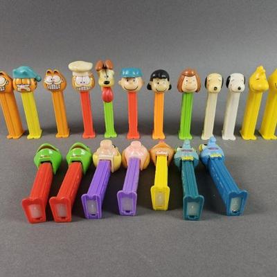 Lot 256 | Garfield, Peanuts, and The Muppets Pez Dispensers