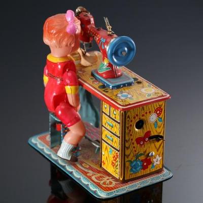 Vintage Japanese Tin & Celluloid Windup Lucky Baby Sewing Machine Toy	5.5x4.75x3.25in	196107
