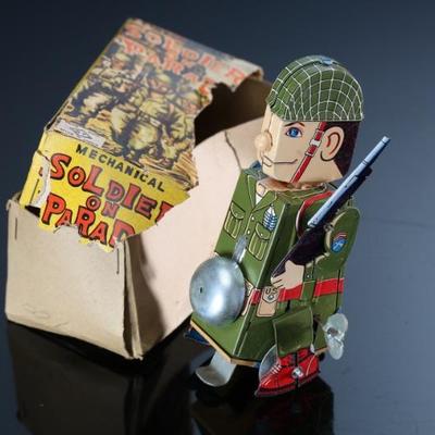 1950s Yonezawa Toys S.Y. Japanese Tin Litho Windup Toy Mechanical Soldier on Parade	6.5x3.15x3.5in	196070
1950s Yonezawa Toys S.Y....