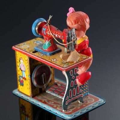 Vintage Japanese Tin & Celluloid Windup Lucky Baby Sewing Machine Toy	5.5x4.75x3.25in	196107
