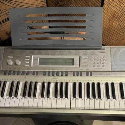 Casio WK-200 comes with black metal sheet music stand