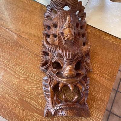 Wooden carved mask from travels 