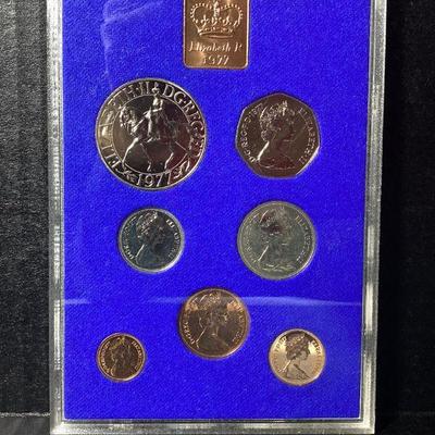 SHBR705 Royal Mint Coinage	A collection of Royal mint coinage from Great Britain and Northern Ireland, minted in 1977 and displayed in a...