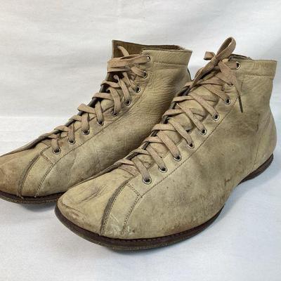 BIHY900 Antique Men's Athletic Shoes	A pair of antique men's athletic shoes. The shoes are crafted from leather, and were most likely...