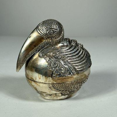 SILVER BIRD BOX | Likely 800 or 835 silver, lidded box in the form of a bird with repousse decoration; 4.10 ozt