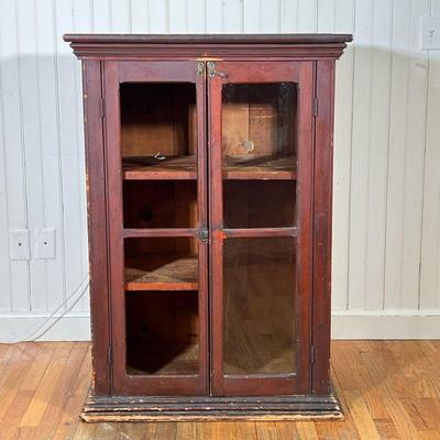 19TH C ANTIQUE STORE DISPLAY CABINET | Paneled display/store cabinet having two glazed doors, old reddish finish