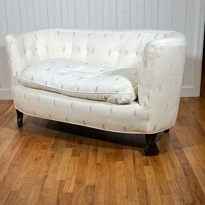 SEAHORSE UPHOLSTERED LOVESEAT | Cream loveseat with light blue seahorse pattern over carved wood legs