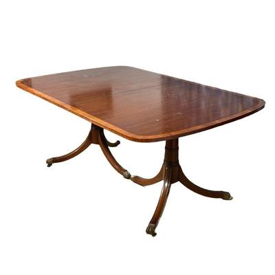 KITTINGER DOUBLE PEDESTAL DINING TABLE | Mahogany with inlay edge. With two leaves, each 18 in. Kittinger Furniture Co., Buffalo NY