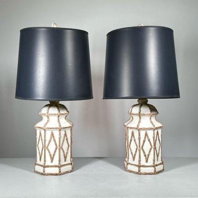 PAIR OF PORCELAIN LAMPS | Porcelain table lamps with applied decoration, black cylindrical shades