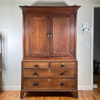 19TH C LINEN PRESS | Having turned wood columns with large open top with carved hooks over 2 half width drawers and 2 full width drawers,...
