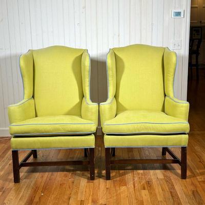 PAIR GREEN WING CHAIRS | Green linen upholstered wingback armchairs with down cushions, and light blue trim