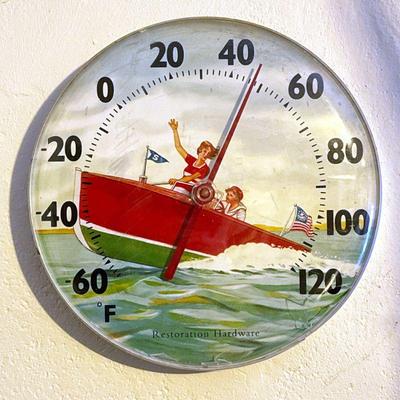 RESTORATION HARDWARE OUTDOOR THERMOMETER | Showing scene of couple riding in speedboat, measures from -60 degrees to 120 degrees Fahrenheit