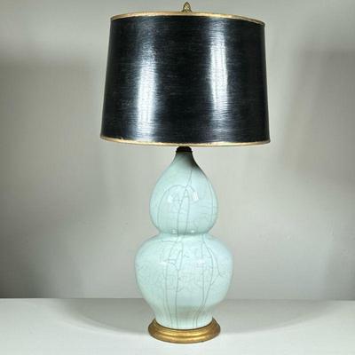 BULBOUS CERAMIC LAMP | Bulbous light blue ceramic lamp with artful crackle glazing and black shade.