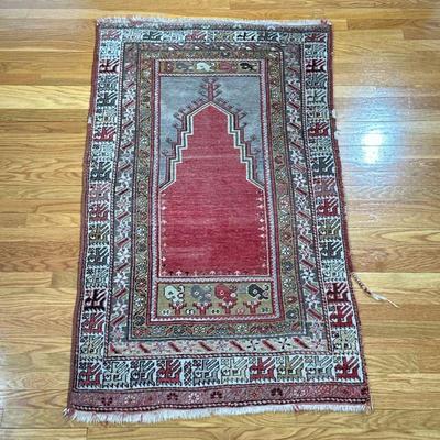 ANTIQUE PRAYER RUG | With geometric patterned border and a red field