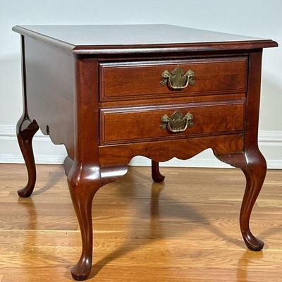 BASSETT CARVED WOOD SIDE TABLE | Having mahogany finish with full width single drawers over cabriole leg