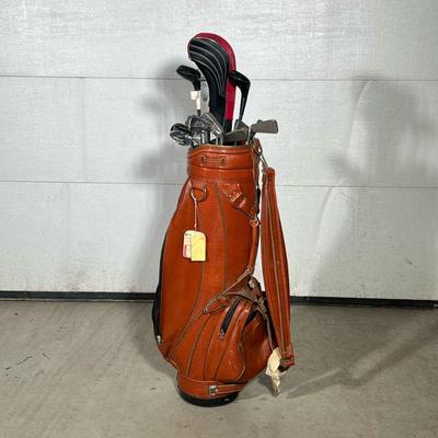 RON MILLER LEATHER GOLF BAG & CLUBS | Includes: Ron Miller Made in USA leather gold bag, Lynx LX3 driver, Spalding Top-Flite 3 & 5, Lynx...