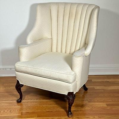 QUEEN ANNE STYLE WING BACK CHAIR | Having curved winged back with rounded arms over carved cabriole legs, upholstered in diamond & dotted...
