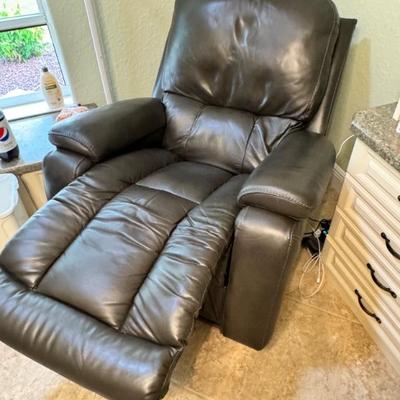 $595 Lazy Boy Recliner with adjustable headrest and lumber. Also with 2 adjustment settings and remote