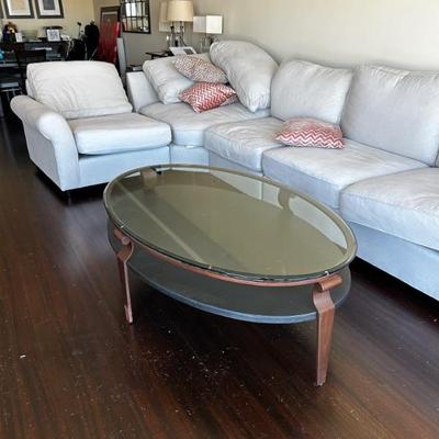 Glass top coffee table with lower shelf