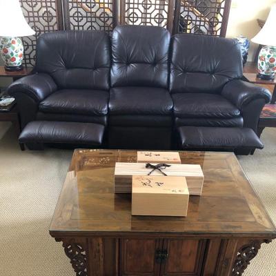 Showing Leather Lazboy sofa with reclining end seats.